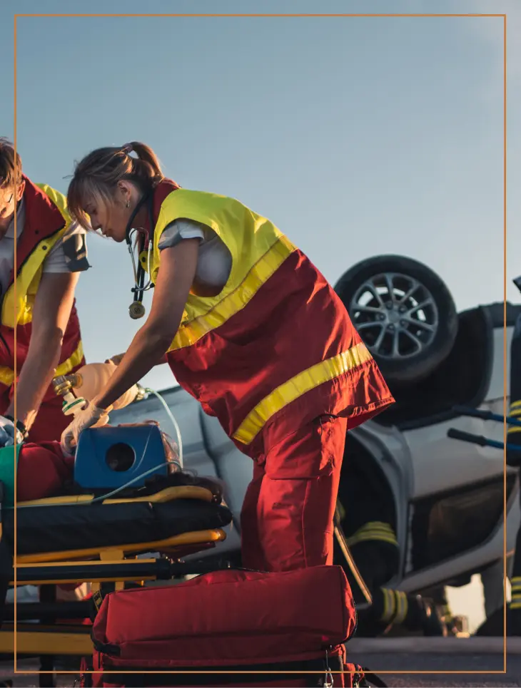 EMS worker attends to a man in a catastrophic car accident in Burbank.