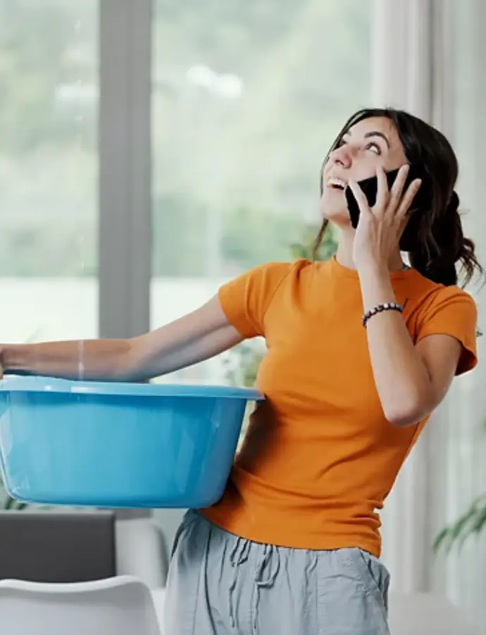 A woman's apartment roof leaks and she collects water before calling a habitability attorney.