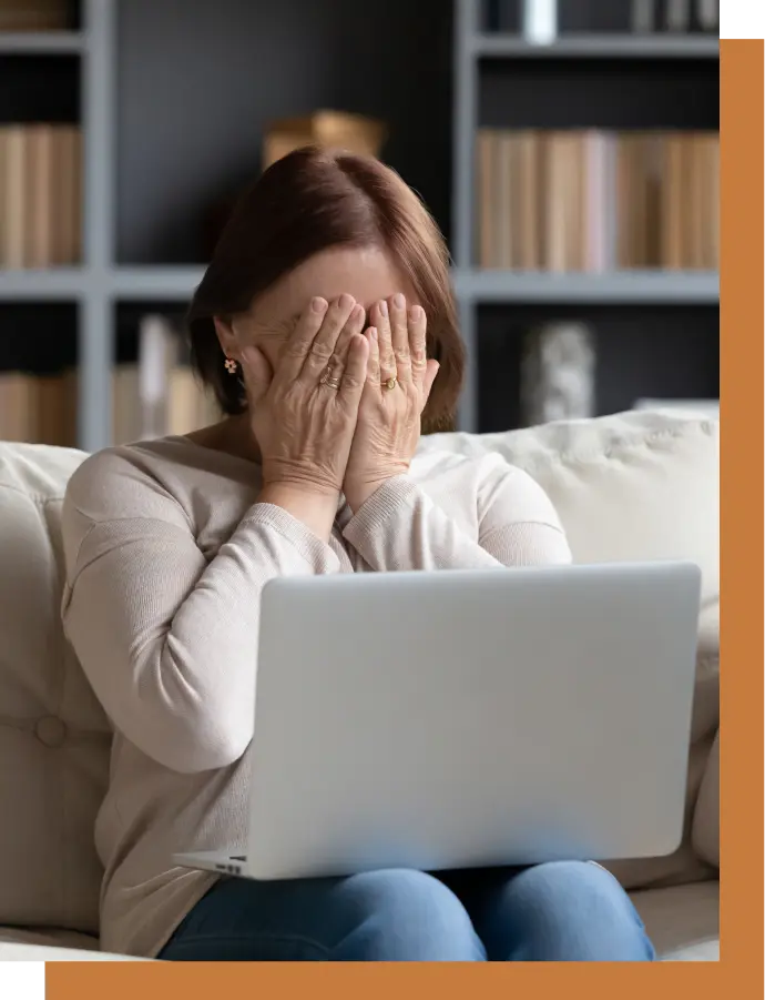 A woman covers her face with her hands after receiving a wrongful death offer.