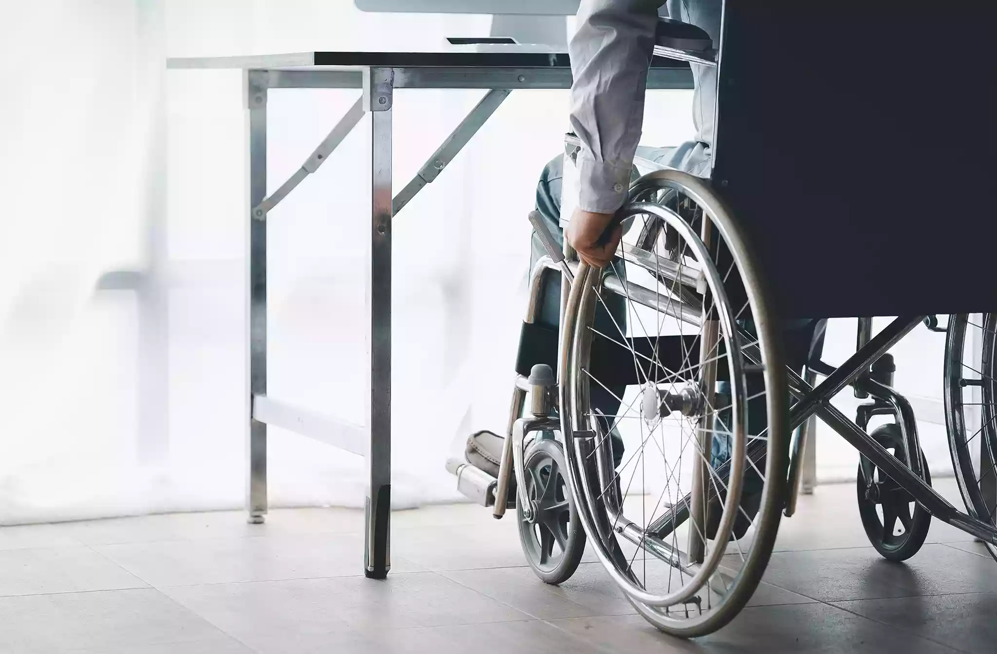 Person using a wheelchair after a serious injury